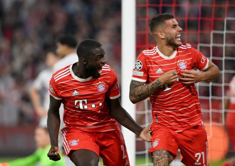Bayern Munich's French defender Lucas Hernandez (R) celebrates scoring the 1-0 goal with Bayern Munich's French defender Dayot Upamecano during the UEFA Champions League Group C football match between FC Bayern Munich and FC Barcelona in Munich, southern Germany on September 13, 2022. (Photo by CHRISTOF STACHE / AFP) (Photo by CHRISTOF STACHE/AFP via Getty Images)
