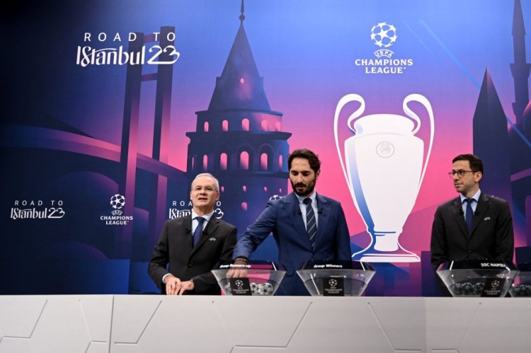 Champions League's ambassador Turkish former footballer Hamit Altintop (C), flanked by UEFA Head of Club Competition Tobias Hedstuck (R) and UEFA Deputy General Secretary Giorgio Marchetti (L), proceeds to the draw for the round of 16 of the 2022-2023 UEFA Champions League football tournament in Nyon on November 7, 2022. (Photo by Fabrice COFFRINI / AFP) (Photo by FABRICE COFFRINI/AFP via Getty Images)