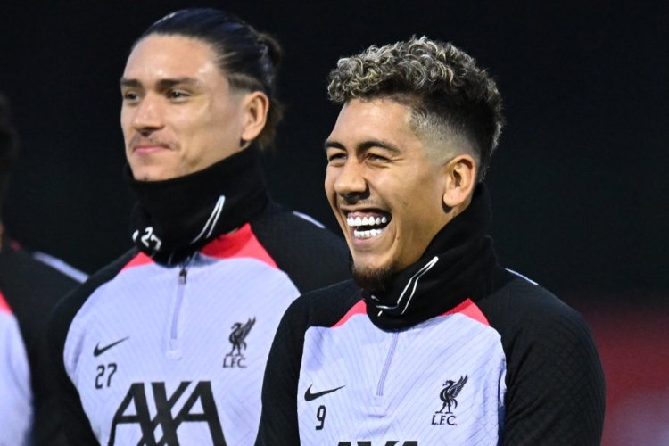 Liverpool's Brazilian striker Roberto Firmino (R) and Liverpool's Uruguayan striker Darwin Nunez (L) smile during a team training session at the AXA Training Centre in Liverpool, north-west England on October 31, 2022, on the eve of the UEFA Champions League group A football match against Napoli. (Photo by Oli SCARFF / AFP) (Photo by OLI SCARFF/AFP via Getty Images)