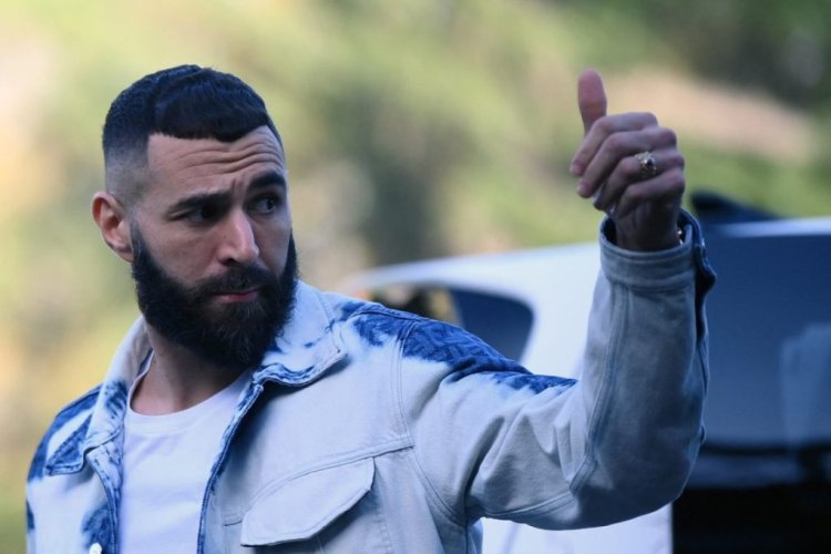 France's forward Karim Benzema gestures as he arrives for a get-together, two days before the French national team leave for the upcoming Qatar 2022 World Cup football tournament, at the team's training ground in Clairefontaine-en-Yvelines, outside Paris on November 14, 2022. - The week-long countdown to the World Cup in Qatar begins as the world's leading footballers focused their attention on one of the most controversial tournaments in history. The first World Cup to be held in the Arab world will kick off on November 20, 2022, when the host nation face Ecuador. (Photo by FRANCK FIFE / AFP) (Photo by FRANCK FIFE/AFP via Getty Images)