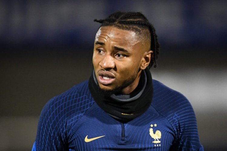 France's national football team forward Christopher Nkunku (R) reacts after being injured during a training session at the team's training camp in Clairefontaine-en-Yvelines, south of Paris, on November 15, 2022, five days ahead of the Qatar 2022 FIFA World Cup football tournament. (Photo by BERTRAND GUAY / AFP) (Photo by BERTRAND GUAY/AFP via Getty Images)
