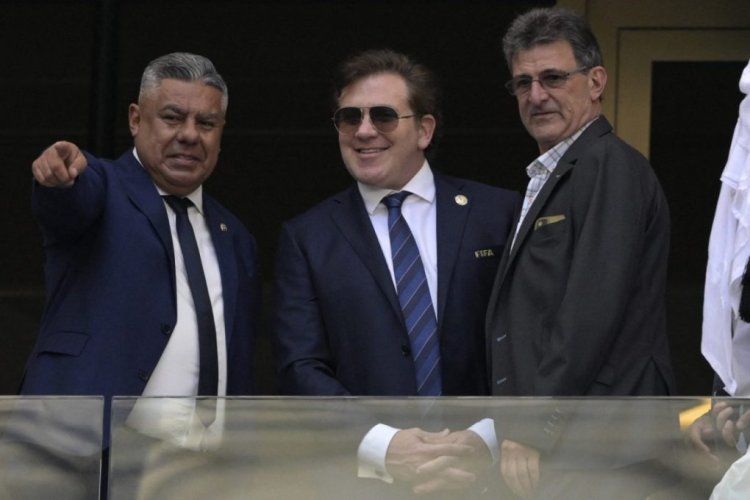 (L-R) The president of the Argentine Football Federation (AFA), Claudio Tapia, the president of the South American Football Confederation (CONMEBOL), Alejandro Dominguez, and Argentine former footballer Mario Kempes chat before the Qatar 2022 World Cup Group C football match between Argentina and Saudi Arabia at the Lusail Stadium in Lusail, north of Doha on November 22, 2022. (Photo by Juan MABROMATA / AFP) (Photo by JUAN MABROMATA/AFP via Getty Images)
