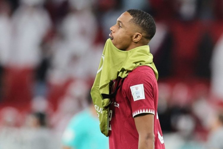 Qatar's defender #02 Pedro Miguel reacts to their defeat on the pitch after the Qatar 2022 World Cup Group A football match between Qatar and Senegal at the Al-Thumama Stadium in Doha on November 25, 2022. (Photo by KARIM JAAFAR / AFP) (Photo by KARIM JAAFAR/AFP via Getty Images)