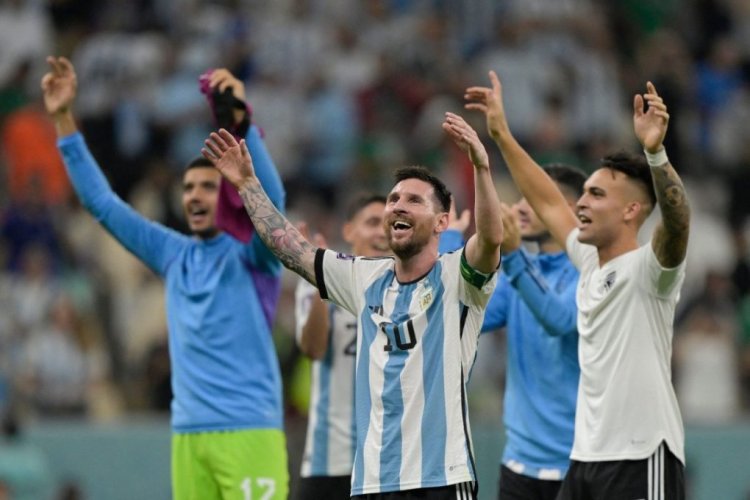 Argentina's forward #10 Lionel Messi reacts with Argentina's forward #22 Lautaro Martinez at the final whistle of the Qatar 2022 World Cup Group C football match between Argentina and Mexico at the Lusail Stadium in Lusail, north of Doha on November 26, 2022. (Photo by JUAN MABROMATA / AFP) (Photo by JUAN MABROMATA/AFP via Getty Images)