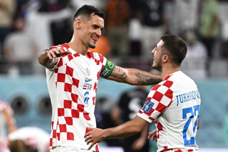Croatia's defender #06 Dejan Lovren (L) and Croatia's defender #22 Josip Juranovic (R) celebrate after their team won the Qatar 2022 World Cup Group F football match between Croatia and Canada at the Khalifa International Stadium in Doha on November 27, 2022. (Photo by Anne-Christine POUJOULAT / AFP) (Photo by ANNE-CHRISTINE POUJOULAT/AFP via Getty Images)