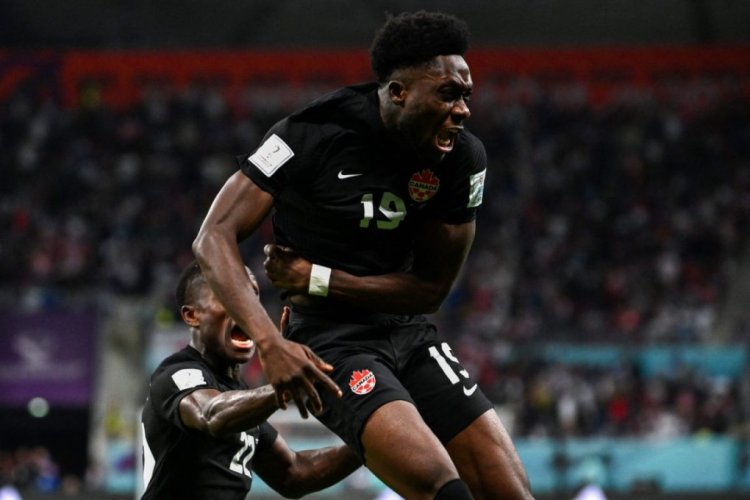 Canada's forward #19 Alphonso Davies celebrates scoring his team's first goal during the Qatar 2022 World Cup Group F football match between Croatia and Canada at the Khalifa International Stadium in Doha on November 27, 2022. (Photo by OZAN KOSE / AFP) (Photo by OZAN KOSE/AFP via Getty Images)