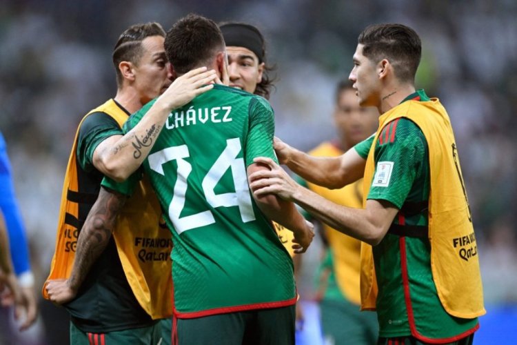 Mexico's midfielder #24 Luis Chavez (C) celebrates with teammates after scoring his team's second goal during the Qatar 2022 World Cup Group C football match between Saudi Arabia and Mexico at the Lusail Stadium in Lusail, north of Doha on November 30, 2022. (Photo by Alfredo ESTRELLA / AFP) (Photo by ALFREDO ESTRELLA/AFP via Getty Images)