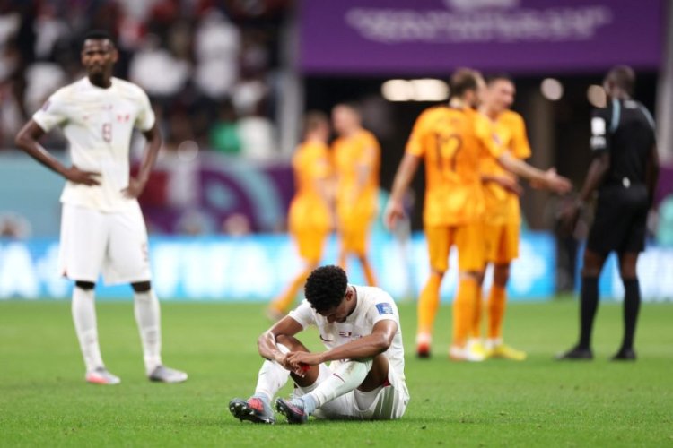 AL KHOR, QATAR - NOVEMBER 29: Homam Ahmed of Qatar reacts after the 0-2 loss during the FIFA World Cup Qatar 2022 Group A match between Netherlands and Qatar at Al Bayt Stadium on November 29, 2022 in Al Khor, Qatar. (Photo by Catherine Ivill/Getty Images)
