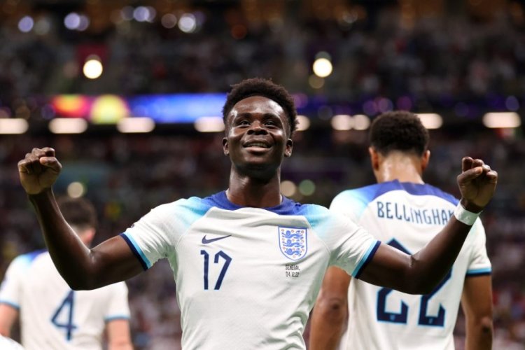 AL KHOR, QATAR - DECEMBER 04: Bukayo Saka of England celebrates after scoring the team's third goal during the FIFA World Cup Qatar 2022 Round of 16 match between England and Senegal at Al Bayt Stadium on December 04, 2022 in Al Khor, Qatar. (Photo by Catherine Ivill/Getty Images)