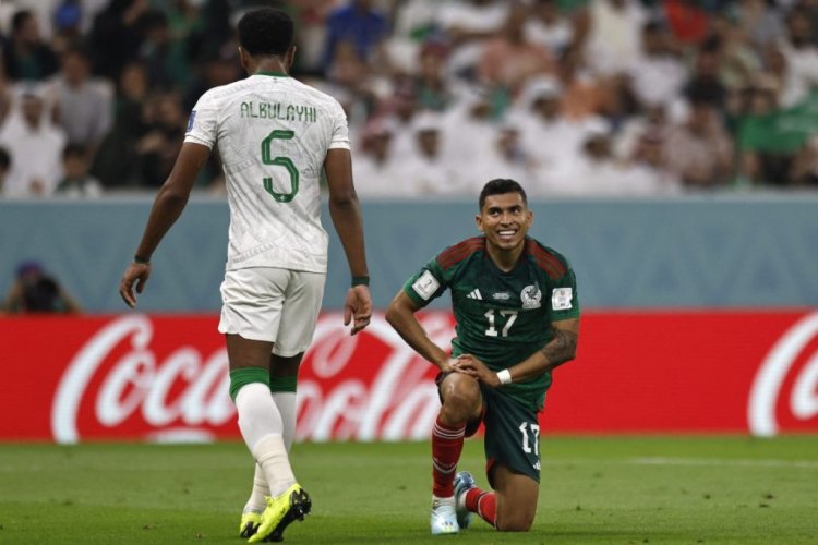 Mexico's midfielder #17 Orbelin Pineda (R) looks at Saudi Arabia's defender #05 Ali Al-Bulaihi (L) during the Qatar 2022 World Cup Group C football match between Saudi Arabia and Mexico at the Lusail Stadium in Lusail, north of Doha on November 30, 2022. (Photo by Khaled DESOUKI / AFP) (Photo by KHALED DESOUKI/AFP via Getty Images)