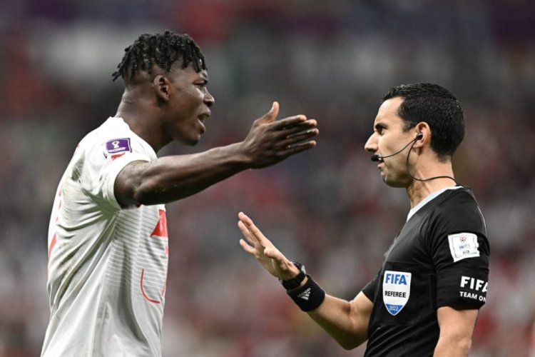 Switzerland's forward #07 Breel Embolo (L) argues with Mexican referee Cesar Ramos during the Qatar 2022 World Cup round of 16 football match between Portugal and Switzerland at Lusail Stadium in Lusail, north of Doha on December 6, 2022. (Photo by Fabrice COFFRINI / AFP) (Photo by FABRICE COFFRINI/AFP via Getty Images)