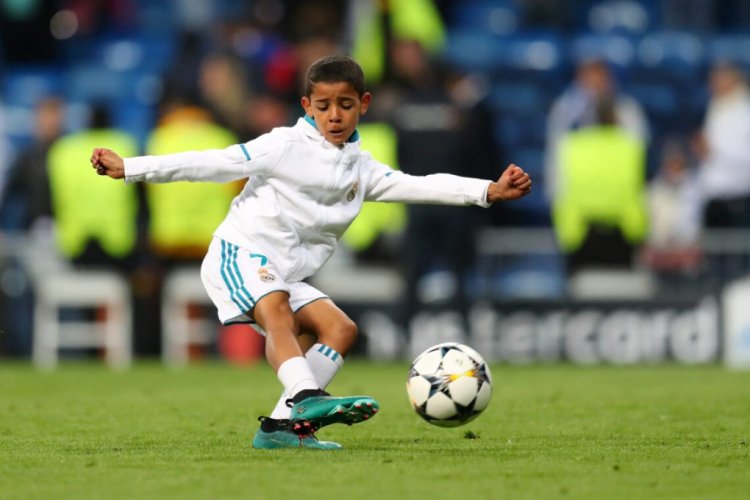 MADRID, SPAIN - MAY 01: Cristiano Ronaldo Jr. plays football on the pitch after the UEFA Champions League Semi Final Second Leg match between Real Madrid and Bayern Muenchen at the Bernabeu on May 1, 2018 in Madrid, Spain.  (Photo by Catherine Ivill/Getty Images)