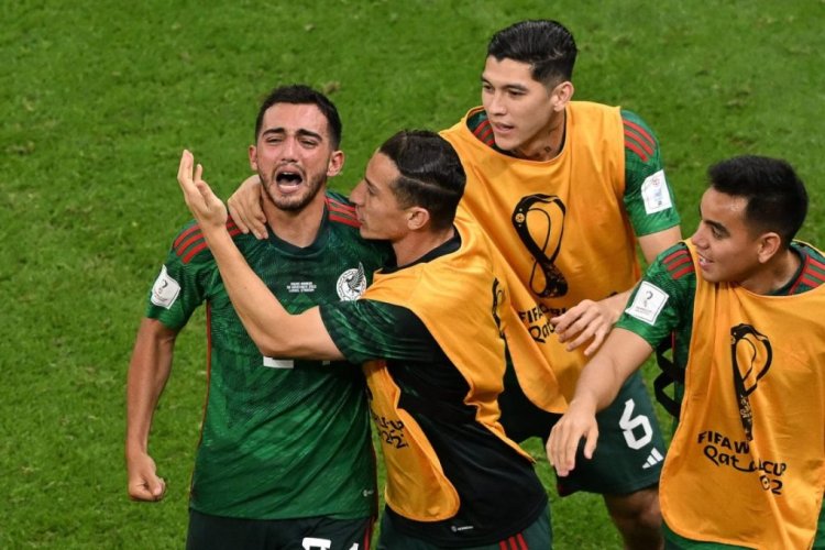 TOPSHOT - Mexico's midfielder #24 Luis Chavez (L) celebrates with teammates after scoring his team's second goal from a free-kick during the Qatar 2022 World Cup Group C football match between Saudi Arabia and Mexico at the Lusail Stadium in Lusail, north of Doha on November 30, 2022. (Photo by Pablo PORCIUNCULA / AFP) (Photo by PABLO PORCIUNCULA/AFP via Getty Images)