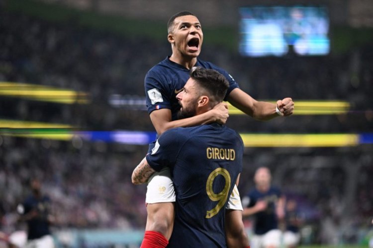 TOPSHOT - France's forward #09 Olivier Giroud celebrates with France's forward #10 Kylian Mbappe (top) after scoring his team's first goal during the Qatar 2022 World Cup round of 16 football match between France and Poland at the Al-Thumama Stadium in Doha on December 4, 2022. (Photo by Kirill KUDRYAVTSEV / AFP) (Photo by KIRILL KUDRYAVTSEV/AFP via Getty Images)