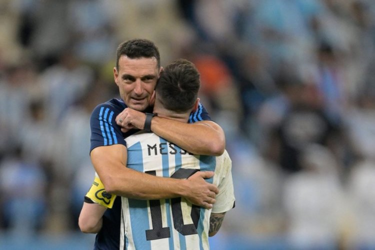 TOPSHOT - Argentina's forward #10 Lionel Messi is embraced by Argentina's coach #00 Lionel Scaloni after their team's victory in the Qatar 2022 World Cup quarter-final football match between The Netherlands and Argentina at Lusail Stadium, north of Doha on December 9, 2022. (Photo by JUAN MABROMATA / AFP) (Photo by JUAN MABROMATA/AFP via Getty Images)