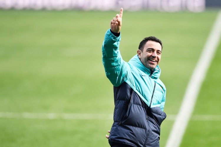 Barcelona's Spanish coach Xavi makes a sign to the crowd during a training session open to fans, at the Camp Nou stadium in Barcelona on January 2, 2023. (Photo by Pau BARRENA / AFP) (Photo by PAU BARRENA/AFP via Getty Images)