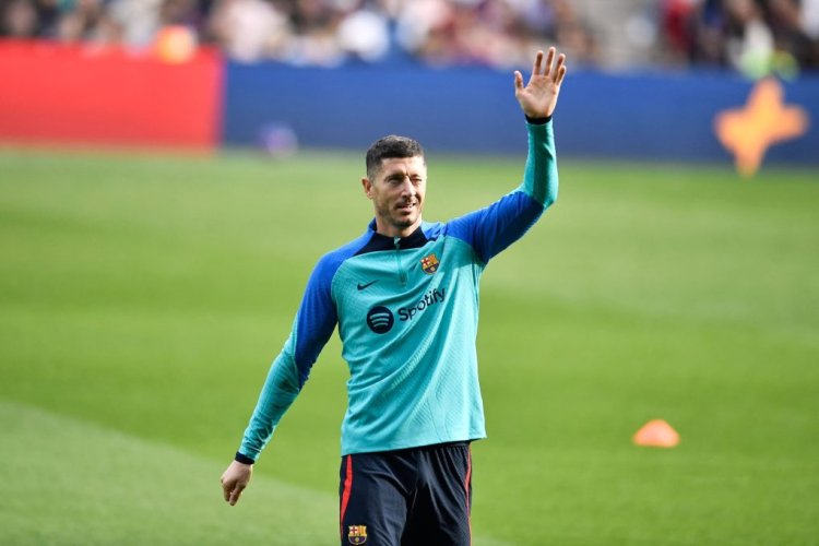 Barcelona's Polish forward Robert Lewandowski waves during a training session, open to fans, at the Camp Nou stadium in Barcelona on January 2, 2023. (Photo by Pau BARRENA / AFP) (Photo by PAU BARRENA/AFP via Getty Images)