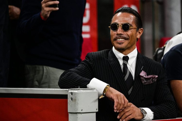 Turkish butcher, chef, food entertainer and restaurateur, Nusret Gokçe, nicknamed Salt Bae, attends the Italian Serie A football match between AC Milan and Napoli on September 18, 2022 at the San Siro stadium in Milan. (Photo by MIGUEL MEDINA / AFP) (Photo by MIGUEL MEDINA/AFP via Getty Images)