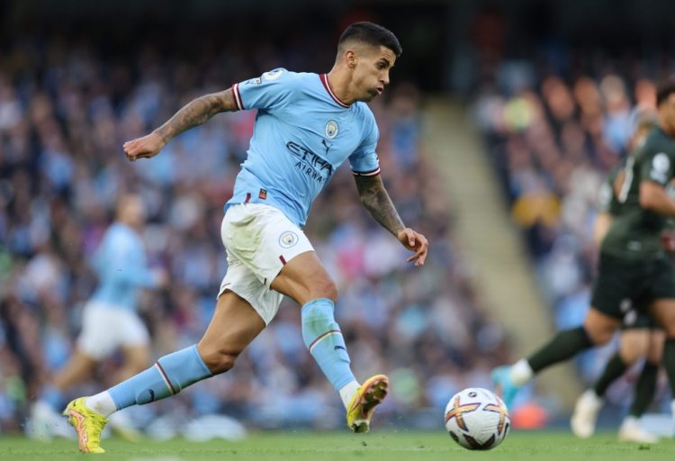 MANCHESTER, ENGLAND - OCTOBER 08: Joao Cancelo of Manchester City passes the ball during the Premier League match between Manchester City and Southampton FC at Etihad Stadium on October 08, 2022 in Manchester, England. (Photo by Clive Brunskill/Getty Images)