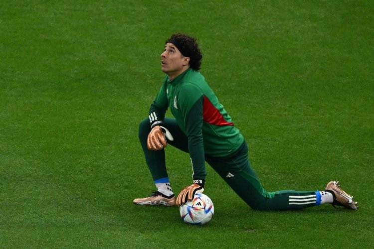TOPSHOT - Mexico's goalkeeper #13 Guillermo Ochoa warms up ahead of the Qatar 2022 World Cup Group C football match between Saudi Arabia and Mexico at the Lusail Stadium in Lusail, north of Doha on November 30, 2022. (Photo by Pablo PORCIUNCULA / AFP) (Photo by PABLO PORCIUNCULA/AFP via Getty Images)