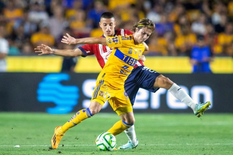Tigres' Mexican midfielder Sebastian Cordova (front) fights for the ball with Guadalajara's Mexican midfielder Roberto Alvarado during the Mexican Clausura tournament final first leg football match between Tigres and Guadalajara at Universitario stadium in Monterrey, Mexico, on May 25, 2023. (Photo by Julio Cesar AGUILAR / AFP) (Photo by JULIO CESAR AGUILAR/AFP via Getty Images)