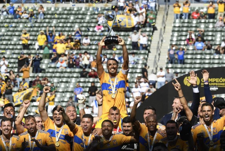 CARSON, CALIFORNIA - JUNE 25: Guido Pizarro #19 of Tigres UANL lifts the championship trophy on the shoulders of goalkeeper Nahuel Guzman #1 after defeating Pachuca 2-1 in the 2023 Campeon de Campeones at Dignity Health Sports Park on June 25, 2023 in Carson, California. (Photo by Kevork Djansezian/Getty Images)